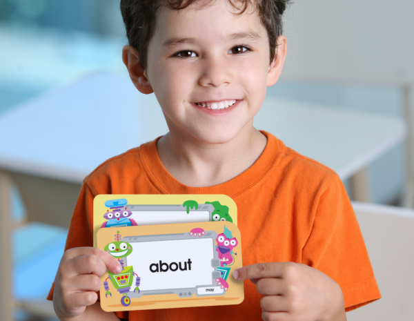 Boy holding sight words flash cards