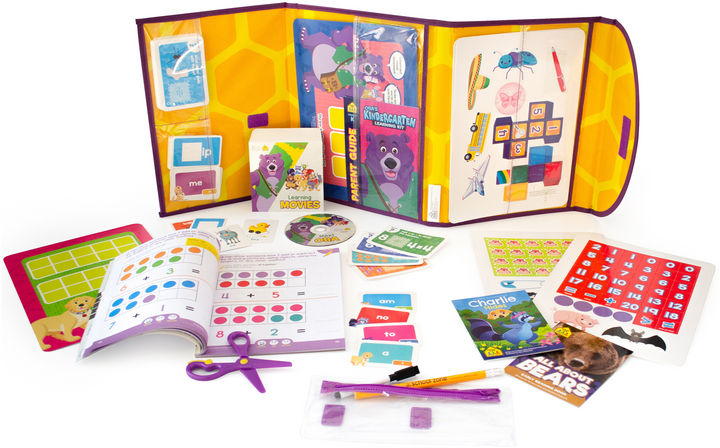  Oba's Kindergarten Learning Pack unfolded with DVD, books, workbooks, flashcards, scissors, game boards, and more spread out