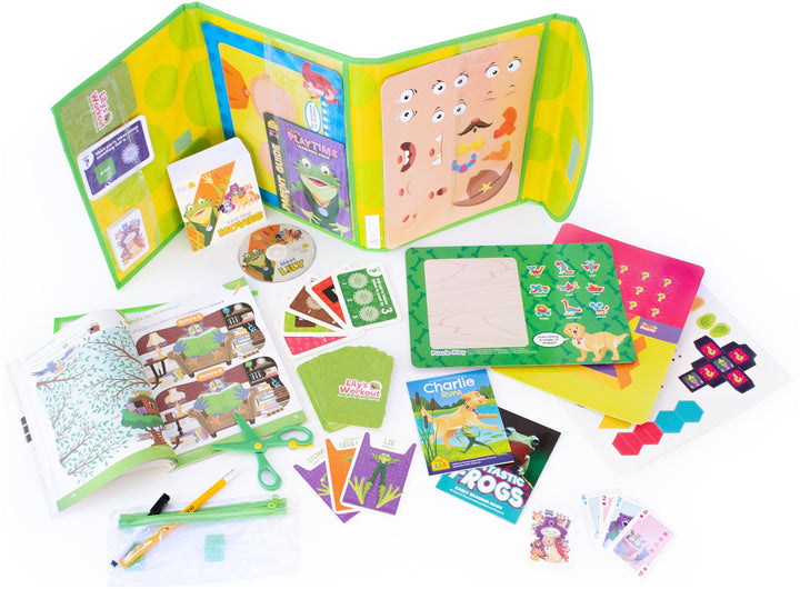 view from above of Lily's Playtime Learning Pack unfolded with DVD, books, workbooks, flashcards, scissors, game boards, and more spread out